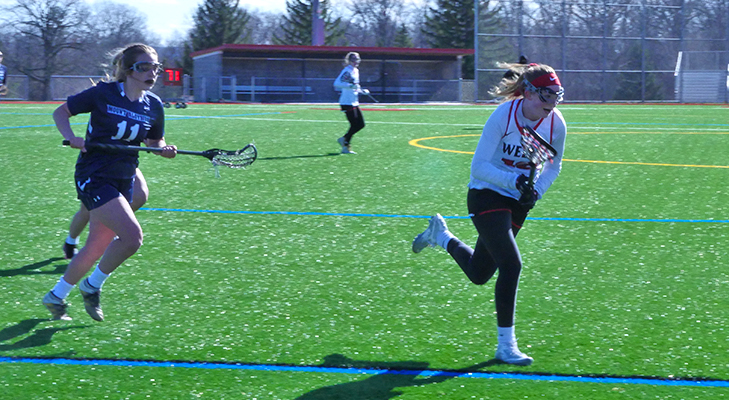 Women’s Lacrosse Team Gets First Conference Win in Rally